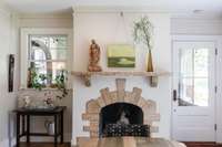 The original (non-functioning) fireplace and mantle adds classic Tudor charm.