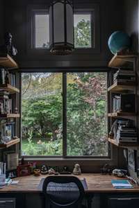 Songwriters and others will find an abundance of inspiration at this desk nook.  Note another reclaimed light-fixture from the same church that provided the fixtures on the 2nd level of the main house.