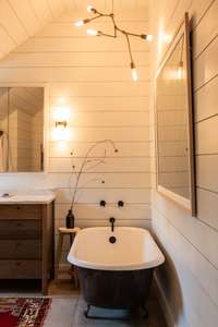 The upstairs bathroom is a DREAM! The horizontal slat wall is difficult to do well, but you'll see quality craftsmanship throughout the upstairs.