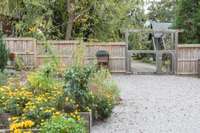 The back yard offers so much. Weddings, family gatherings, and more have been hosted here.  The planter boxes are bathed in sunlight (perfect for home-grown tomatoes) while the rest of the yard offers a shaded respite from the sun.