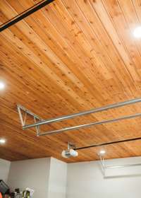 Tongue and groove rough cut Western Cedar ceiling treatment in the heated and cooled garage.