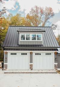 This temperature controlled garage is every man's dream! 10' garage doors for boat storage, epoxy flooring, tongue and groove wooden ceiling treatment, down firing soffit LED lights on the exterior, 400 Amp service, 24 kW whole home generator.