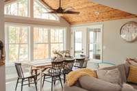 Tongue and groove rough cut Western Cedar custom ceiling treatments in both the dining area and garage.