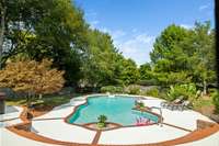 Talk about a back yard oasis!  This giant in ground pool feels like you’re at a resort!