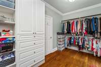 One of the large walk in closets for primary bedroom