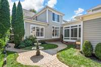 Large courtyard area with lush landscaping and garden