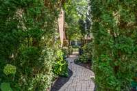 Large courtyard area with lush landscaping and garden