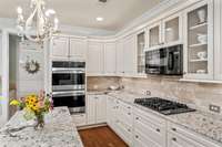 Kitchen complete with custom cabinetry and updated granite