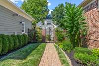 Large courtyard area with lush landscaping and garden