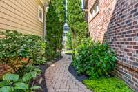 Large courtyard area with lush landscaping and garden