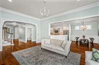 Living room featuring 12 ft ceilings