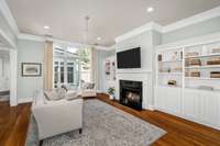 Living room featuring 12 ft ceilings