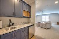 Wet bar next to bonus room