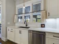 Windows overlook the sunroom