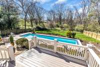 Porch overlooking sparkling pool