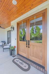 Beautiful Solid Walnut doors at the front entrance offer a timeless look.