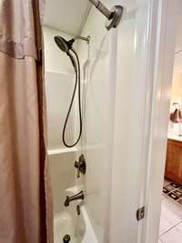 Basement bath has tub/shower combo with double vanities; Basement has 2 beds and 1 bath