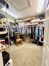 Primary Suite has walk in closet with ample space for hanging and folding of clothes; Carpet; One of a Kind Primary Suite! Must See!