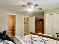 13x14 Bedroom on main level has carpet ceiling fan; This one owner home has been very well maintained