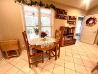 The Kitchen has nice eat in area overlooking the front lawn; flowing into the Laundry Room. Lots of space!