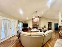 Beautiful hardwood floors in the Living Room/Dining Room combination in this custom one owner built brick home with 3 car garage and full finished basement/apartment