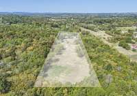 Trees are all along the perimeter of the property.