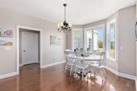 The dining room nestles in the oversized bay window adds a touch of intimacy for the family to enjoy.
