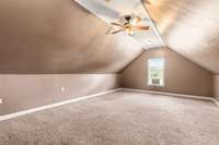 Oversized bonus room offering a second family area for gatherings.