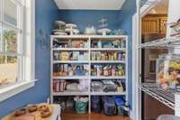 Built in wooden shelving for additional storage.