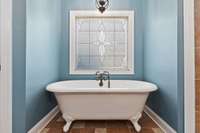 Soaking claw-foot tub to wash away the stress of the day.