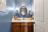 Water closet, on the mail level with beautiful lighting.