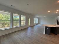 Large windows to frame the gorgeous views of the par 3 of the Five Oaks Golf and Country Club.