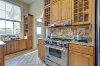 Nice high ceilings and oversized windows provide a sunny space for all your meals. A large walk in pantry is located to the right.