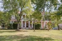 Over 35 picturesque acres of pastureland and lawn -with abundant fruit trees and hardwood trees