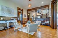 Entry parlor - notice the craftsmanship of the original woodwork trim, and the historic Lincrusta wall covering adorning the space.