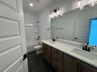 Secondary bathroom has double sinks!