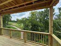 Large covered deck to soak in the golf course views!