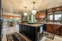 large kitchen with quartz countertops and granite island