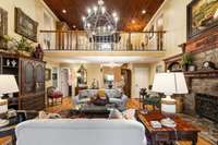 stone fireplace with gas logs, built-ins on both sides