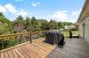 Back deck - trees line the backyard for privacy