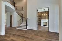 Elegant Two-story Foyer with curved staircase.