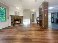 Another view from the den, facing towards the kitchen on the right.  You can see the master suite entrance, as well.