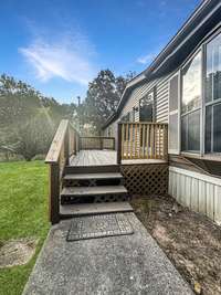 Walking from the driveway onto the new front deck.