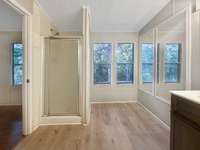 Stand up shower and extra floor space in the master bathroom.