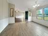 The dining room, looking back towards the front door and living room.