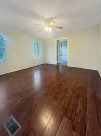 The master bedroom has updated flooring.