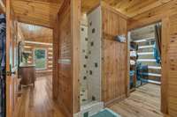 Imported tile beautifully adorns the custom shower in the primary bedroom.