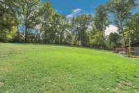 The 3.59 acre lot provides for a peaceful view of the ample backyard from the rear patio sitting areas.