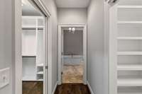 Two extra large walk in closets with built ins