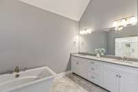 Primary bath with carrara marble floors